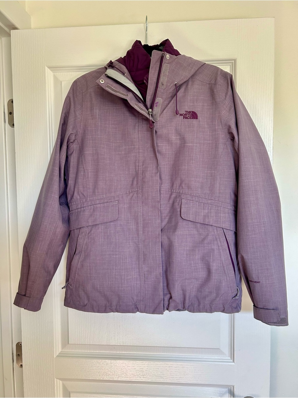 The North Face Women's gray  triclimate jacket with purple jacket inside.